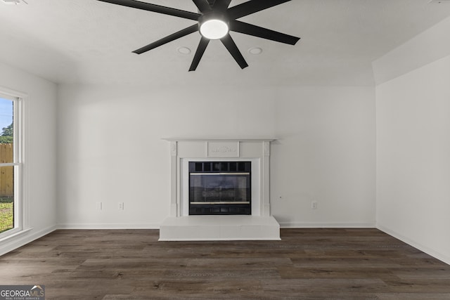 5437 Chatham Woods Ct, Columbus, GA 31907 - unfurnished living room with healthy amount of natural light, a glass covered fireplace, ceiling fan, and wood finished floors