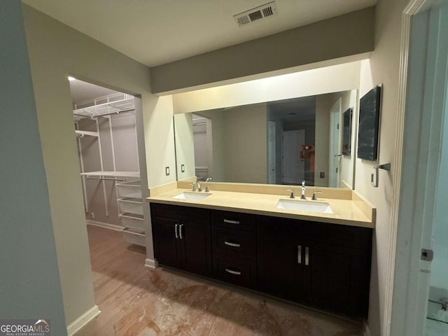 40 Dunwoody Springs Dr, Atlanta, GA 30328 - full bath with double vanity, a spacious closet, and wood finished floors