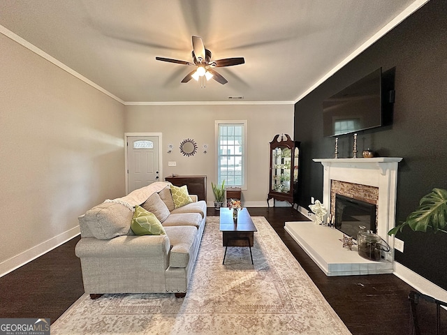 6192 Collins St NE, Covington, GA 30014 - living room with a ceiling fan, crown molding, a fireplace, and wood finished floors