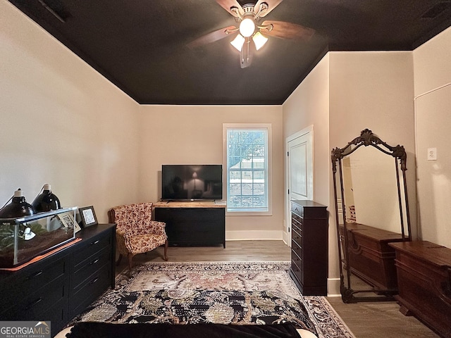 6192 Collins St NE, Covington, GA 30014 - bedroom with wood finished floors and a ceiling fan