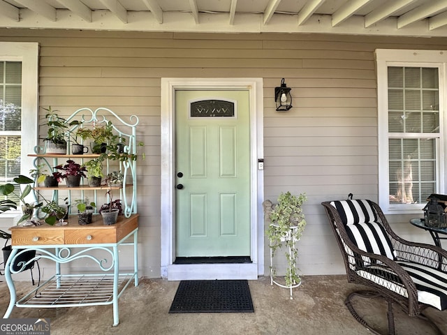 6192 Collins St NE, Covington, GA 30014 - property entrance with a porch