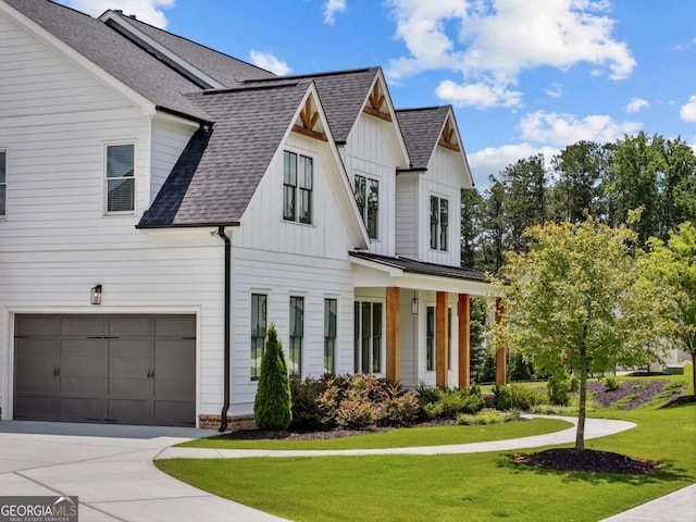 6080 Simone St, Acworth, GA 30101 - modern farmhouse style home featuring an attached garage, a front lawn, board and batten siding, and a shingled roof