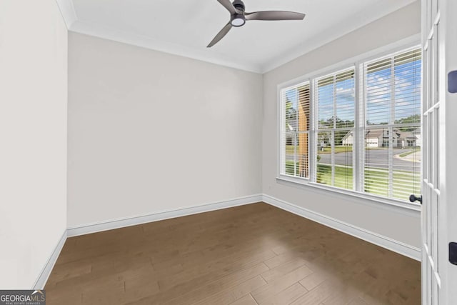 6080 Simone St, Acworth, GA 30101 - spare room featuring dark wood finished floors, healthy amount of natural light, a ceiling fan, and ornamental molding