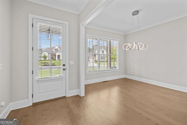 6080 Simone St, Acworth, GA 30101 - entryway featuring crown molding, plenty of natural light, and wood finished floors