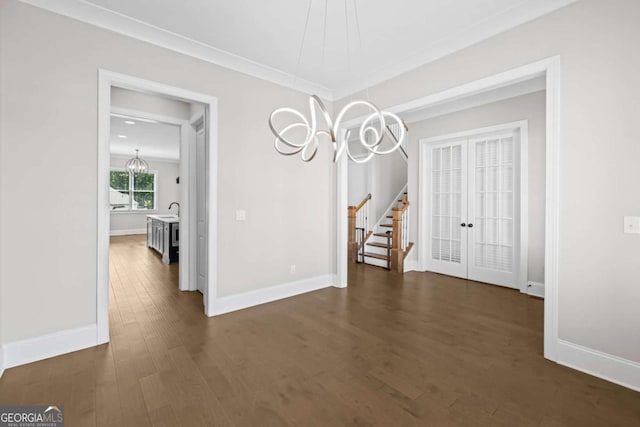 6080 Simone St, Acworth, GA 30101 - unfurnished dining area with a chandelier, dark wood-style floors, french doors, stairs, and crown molding