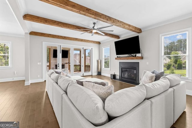 6080 Simone St, Acworth, GA 30101 - living area with a fireplace with flush hearth, beamed ceiling, french doors, wood finished floors, and a ceiling fan
