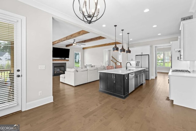 6080 Simone St, Acworth, GA 30101 - kitchen featuring appliances with stainless steel finishes, white cabinets, light countertops, open floor plan, and recessed lighting