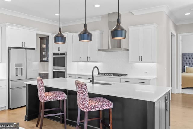 6080 Simone St, Acworth, GA 30101 - kitchen with appliances with stainless steel finishes, ornamental molding, light wood finished floors, light countertops, and recessed lighting