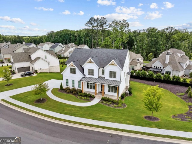 6080 Simone St, Acworth, GA 30101 - view of front of property with a standing seam roof, a residential view, a porch, and a front yard