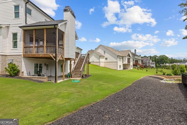 6080 Simone St, Acworth, GA 30101 - back of property featuring a sunroom, a residential view, stairway, a chimney, and a patio