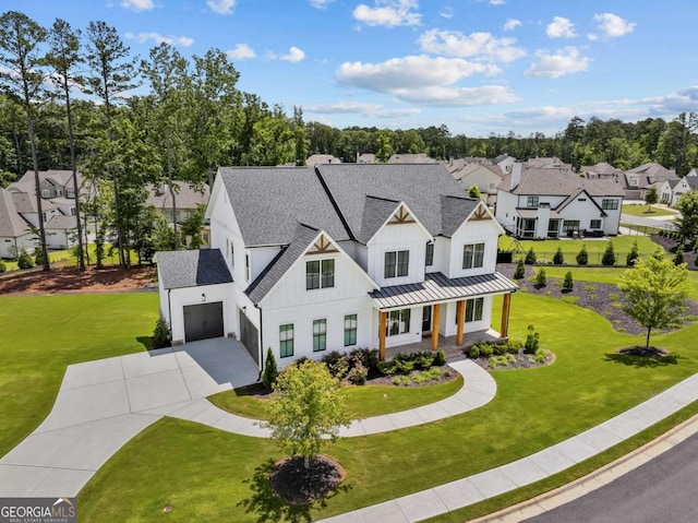 6080 Simone St, Acworth, GA 30101 - modern inspired farmhouse featuring covered porch, driveway, board and batten siding, a garage, and a shingled roof