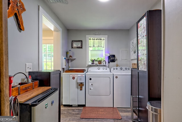 11 Hamilton Cir, Blairsville, GA 30512 - washroom with dark wood-style flooring, washing machine and clothes dryer, and plenty of natural light
