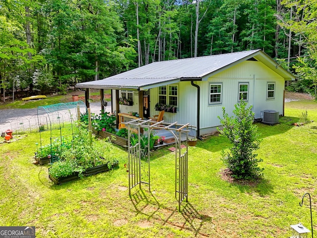 11 Hamilton Cir, Blairsville, GA 30512 - back of house with a garden, a yard, and a metal roof
