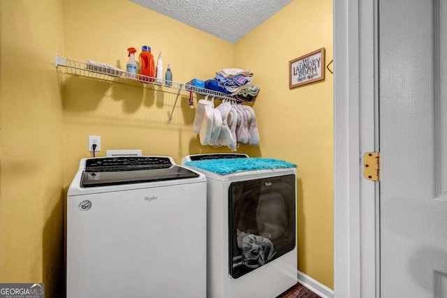 15 Saddlebrook Ct, Covington, GA 30016 - laundry room with washing machine and clothes dryer and a textured ceiling