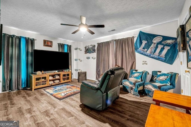 15 Saddlebrook Ct, Covington, GA 30016 - living room featuring a textured ceiling, wood finished floors, and ceiling fan