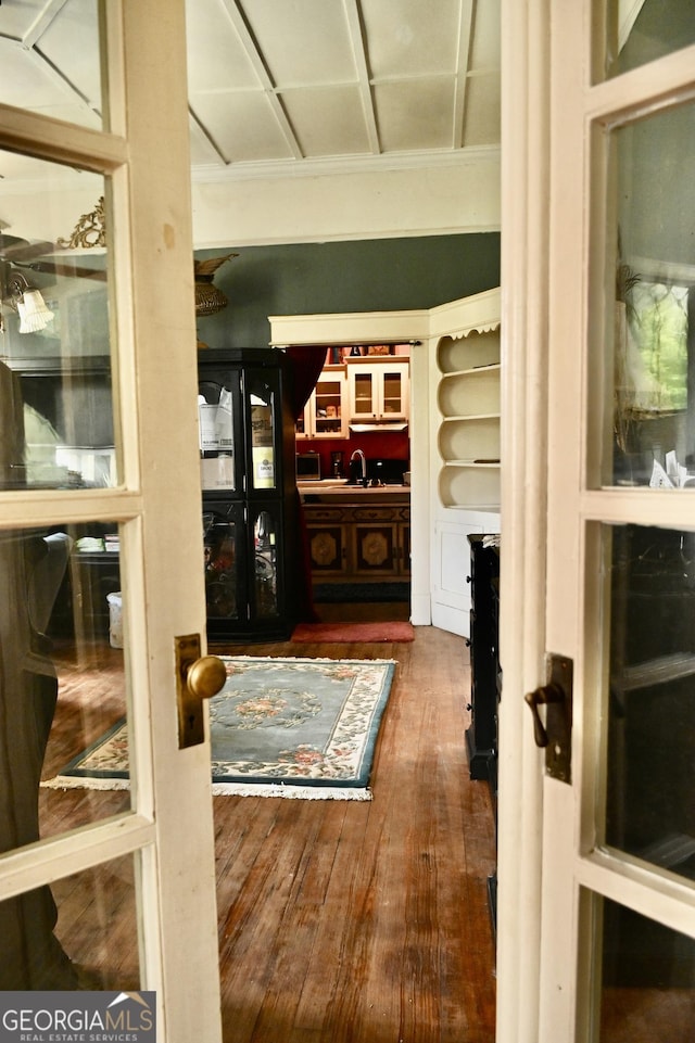 5321 Oak St, Eastman, GA 31023 - hall featuring wood finished floors and a sink