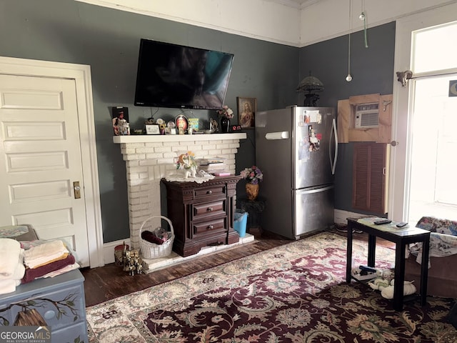 5321 Oak St, Eastman, GA 31023 - living area with wood finished floors and a wall mounted AC