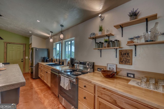 1529 Cedar Vw, Hiawassee, GA 30546 - kitchen featuring appliances with stainless steel finishes, open shelves, concrete flooring, and decorative light fixtures