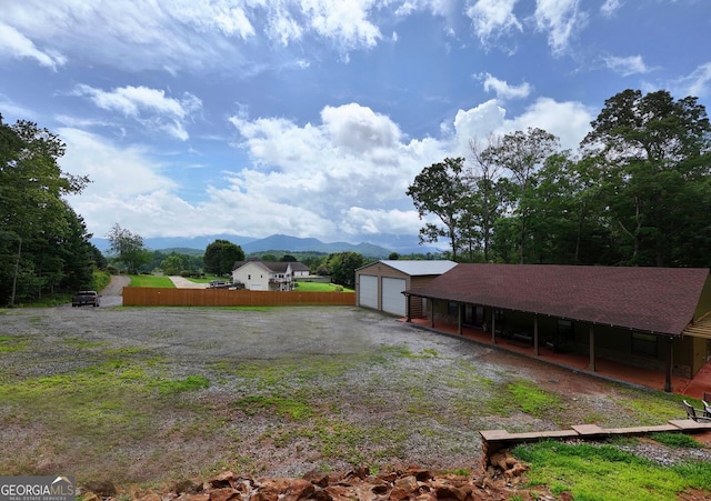 1529 Cedar Vw, Hiawassee, GA 30546 - view of yard with a mountain view, an outdoor structure, and a garage