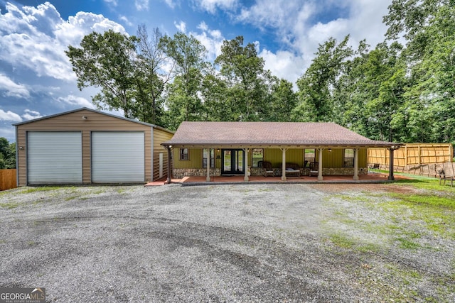 1529 Cedar Vw, Hiawassee, GA 30546 - ranch-style house featuring covered porch, a garage, an outdoor structure, and roof with shingles