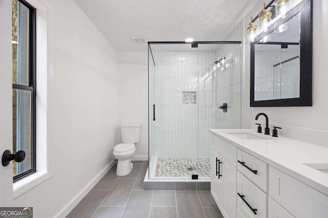 3292 Holly Mill Ct, Marietta, GA 30062 - bathroom featuring a stall shower, double vanity, tile patterned floors, and a textured ceiling