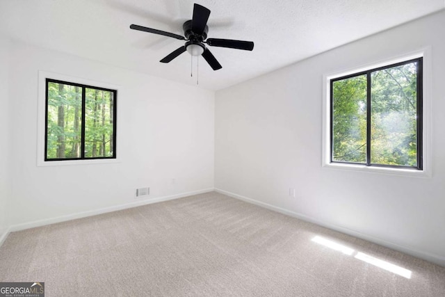 3292 Holly Mill Ct, Marietta, GA 30062 - unfurnished room with healthy amount of natural light, carpet, and a ceiling fan