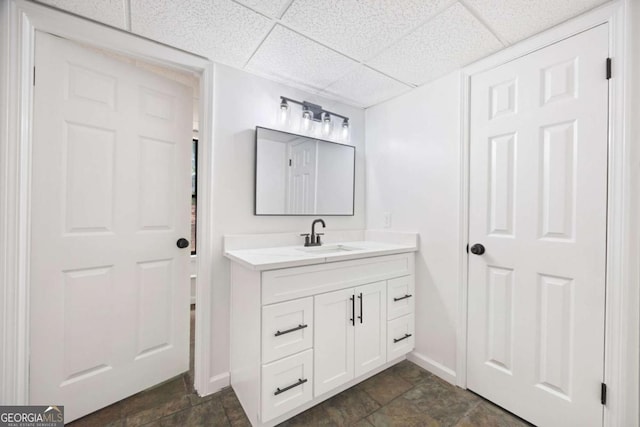 3292 Holly Mill Ct, Marietta, GA 30062 - bathroom featuring vanity, stone finish floors, and a drop ceiling