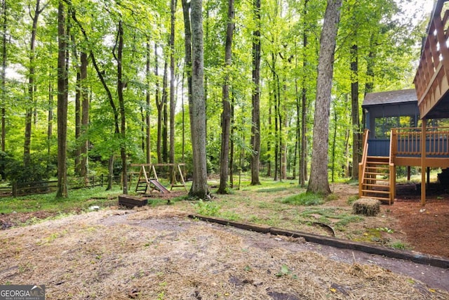 3292 Holly Mill Ct, Marietta, GA 30062 - view of yard featuring stairs, a deck, and a sunroom