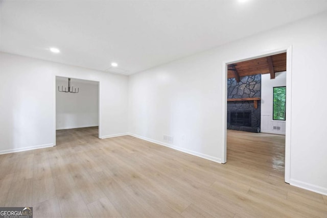 3292 Holly Mill Ct, Marietta, GA 30062 - empty room with light wood-type flooring, a fireplace, and recessed lighting