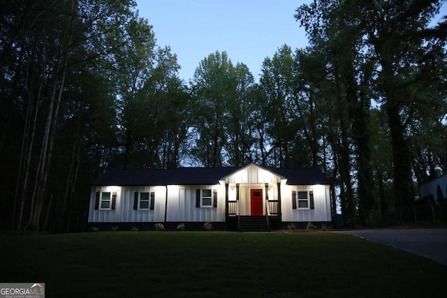 2798 Hutchins Rd, Lawrenceville, GA 30044 - view of front of home featuring a front yard and board and batten siding