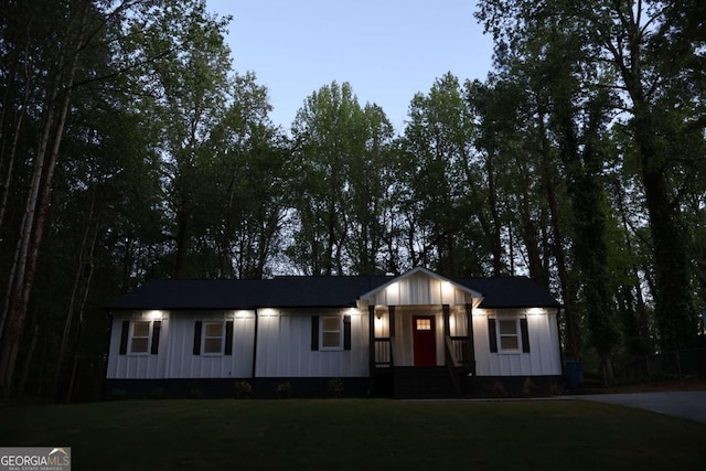 2798 Hutchins Rd, Lawrenceville, GA 30044 - view of front facade with a front lawn and board and batten siding
