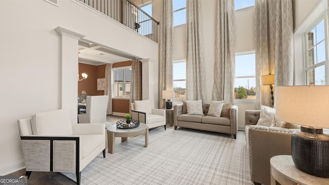 687 Edgar St Lot 83, Hampton, GA 30228 - living room with a high ceiling, a chandelier, and ornamental molding