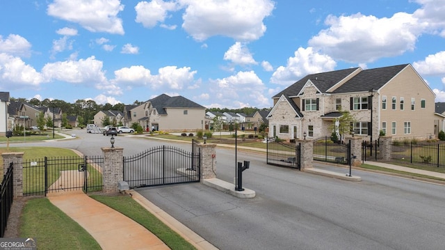 687 Edgar St Lot 83, Hampton, GA 30228 - view of asphalt street featuring sidewalks, a gate, a residential view, and curbs