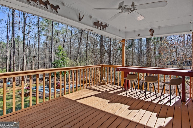 105 S Arcadia Dr, Bogart, GA 30622 - deck featuring ceiling fan and view of scattered trees
