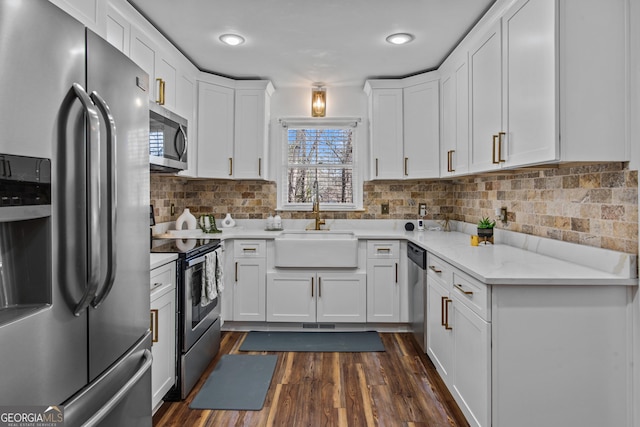 105 S Arcadia Dr, Bogart, GA 30622 - kitchen featuring appliances with stainless steel finishes, white cabinets, dark wood finished floors, backsplash, and recessed lighting