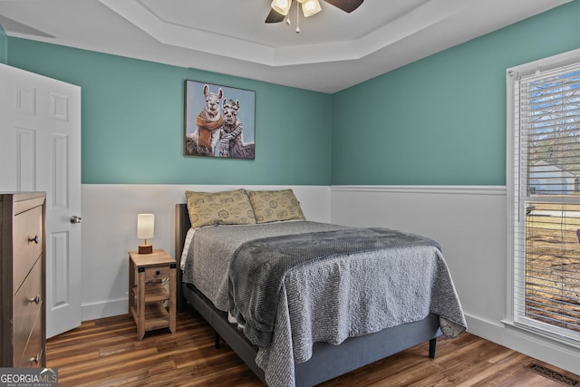 105 S Arcadia Dr, Bogart, GA 30622 - bedroom featuring a raised ceiling, wood finished floors, and ceiling fan