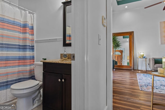 105 S Arcadia Dr, Bogart, GA 30622 - full bath featuring wood finished floors, vanity, a ceiling fan, and a shower with curtain