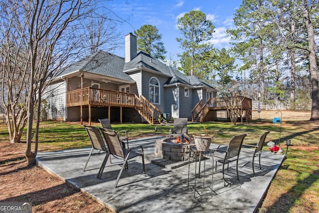 105 S Arcadia Dr, Bogart, GA 30622 - rear view of property with stairway, a wooden deck, an outdoor fire pit, and a patio area