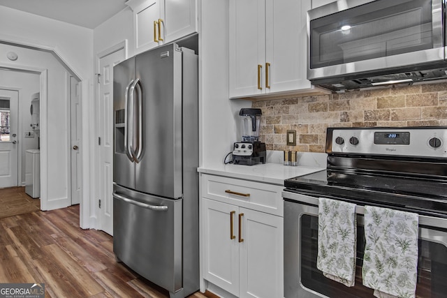 105 S Arcadia Dr, Bogart, GA 30622 - kitchen featuring stainless steel appliances, white cabinets, tasteful backsplash, and dark wood-type flooring