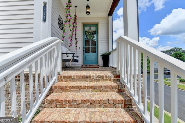 767 Farmstead Rd, Suwanee, GA 30024 - doorway to property with covered porch