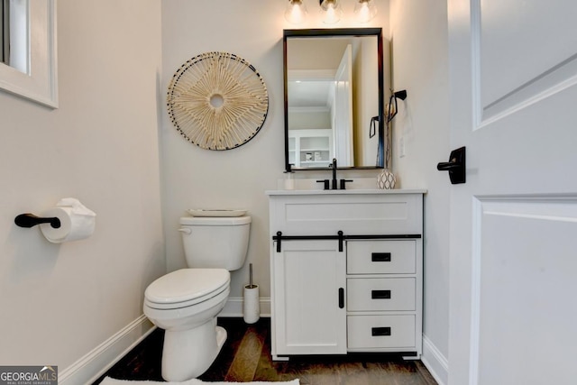 767 Farmstead Rd, Suwanee, GA 30024 - bathroom featuring vanity and wood finished floors