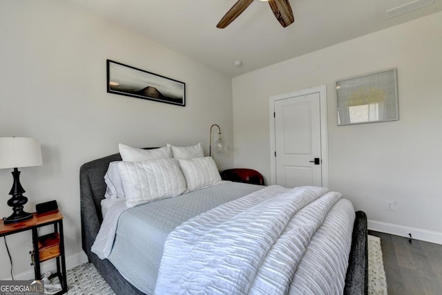 767 Farmstead Rd, Suwanee, GA 30024 - bedroom with dark wood-style floors and a ceiling fan