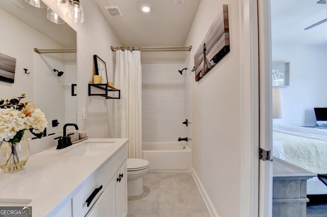 767 Farmstead Rd, Suwanee, GA 30024 - ensuite bathroom featuring double vanity, shower / bath combination with curtain, and tile patterned floors