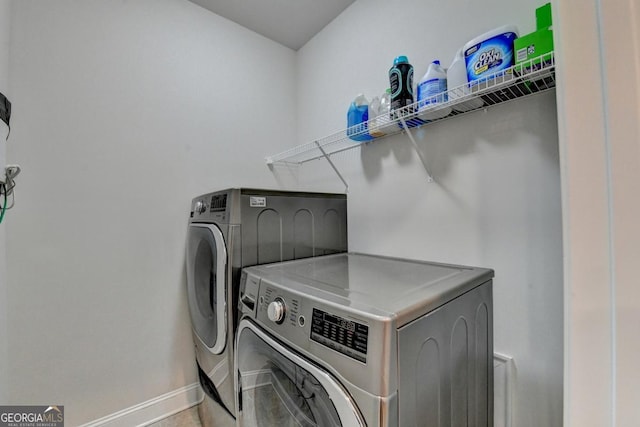 767 Farmstead Rd, Suwanee, GA 30024 - washroom with washing machine and clothes dryer and baseboards