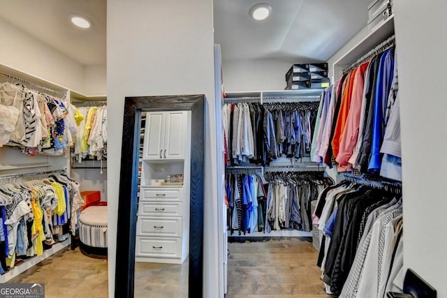 767 Farmstead Rd, Suwanee, GA 30024 - spacious closet with lofted ceiling and wood finished floors