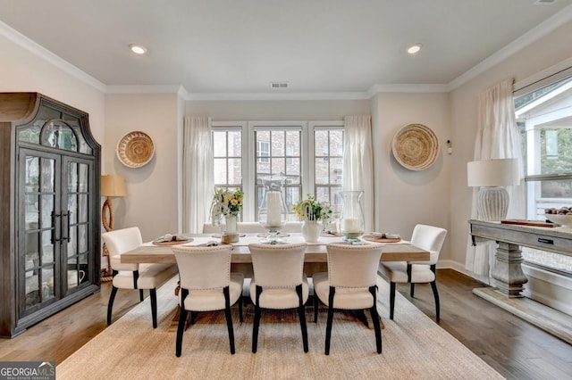767 Farmstead Rd, Suwanee, GA 30024 - dining room with crown molding, wood finished floors, and recessed lighting