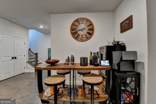 767 Farmstead Rd, Suwanee, GA 30024 - bar area with stairs, concrete flooring, and recessed lighting