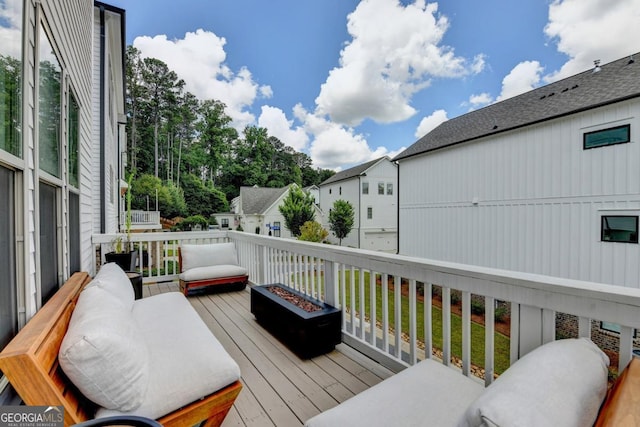 767 Farmstead Rd, Suwanee, GA 30024 - wooden terrace with a fire pit and a residential view