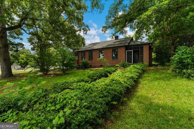3105 Woodlawn Ave, Columbus, GA 31904 - back of house featuring brick siding, a chimney, and crawl space