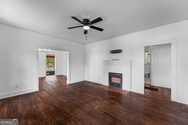 3105 Woodlawn Ave, Columbus, GA 31904 - unfurnished living room with a fireplace, a ceiling fan, wood finished floors, and a chandelier